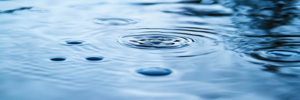 Close-up of water ripples creating circular patterns in fresh water surface photo