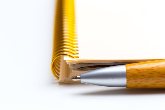 Pen and notebook close up photo