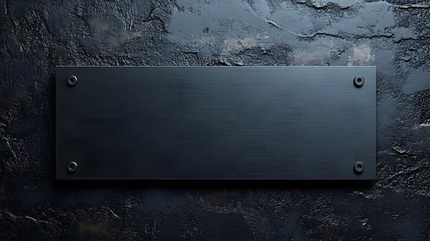Brushed steel black metal plate exhibits sleek industrial design with rectangular shape and dark finish, mounted on wall with soft ambient lighting. cold photo