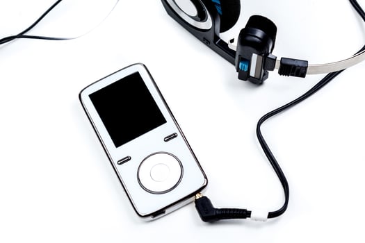 audio player with headphones isolated on white background photo