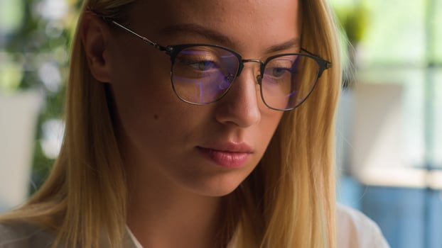 Close up busy Caucasian businesswoman female student girl entrepreneur working with laptop computer work at office focused woman manager executive worker in eyeglasses studying online business project photo