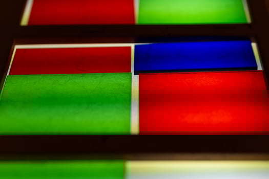 Colorful stained glass panels showcase vibrant patterns in architectural design photo