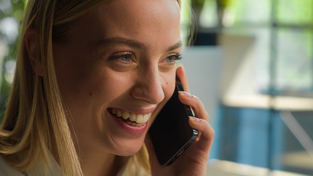 Close up head shot Caucasian businesswoman smiling girl talk mobile phone carefree woman laughing talking smartphone at office female employer manager speak chatter business conversation answer call photo