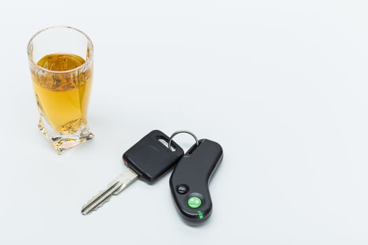Car key on the bar with spilled alcohol photo