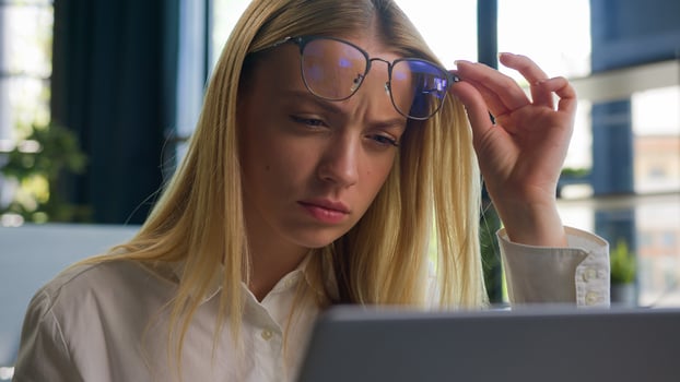 Confused Caucasian businesswoman in eyeglasses girl business woman employee take off glasses problem bad vision blurry sight reading on laptop overwork in office check eyesight ophthalmology service photo
