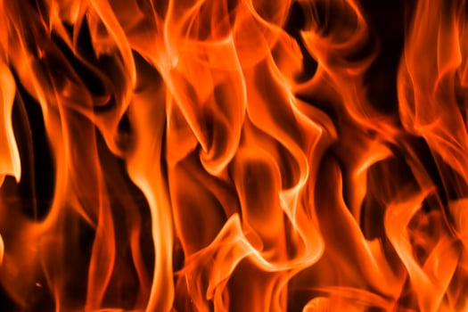 Flames of fire on a black background. The mystery of fire. photo