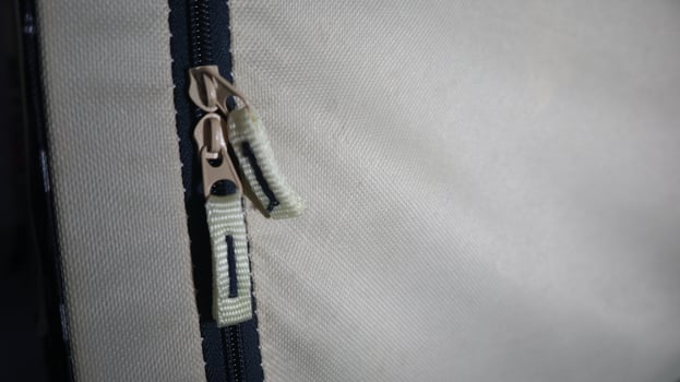 a photo of a zipper on a bag that has two