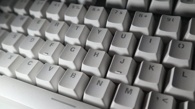 a close up photo of a computer keyboard