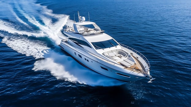 Luxury Yacht Cruising in Open Sea with Clear Sky and Turbulent Wake photo