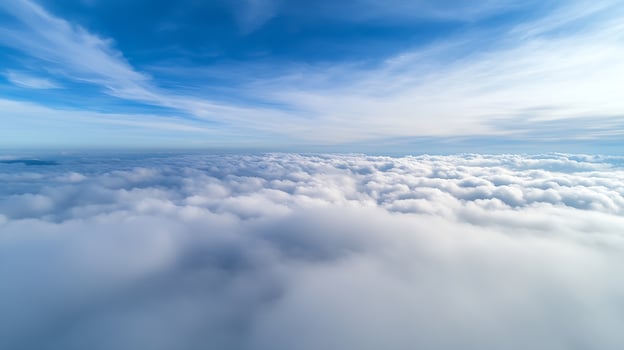Wide Angle View of Majestic Clouds Expanding Across Endless Blue Sky photo