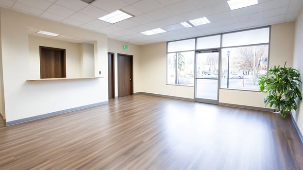 Bright empty office lobby with large windows and wooden flooring for business use photo