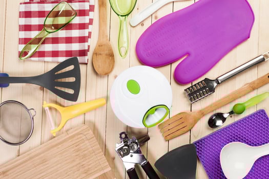 cookware and accessories on a wooden table. photo