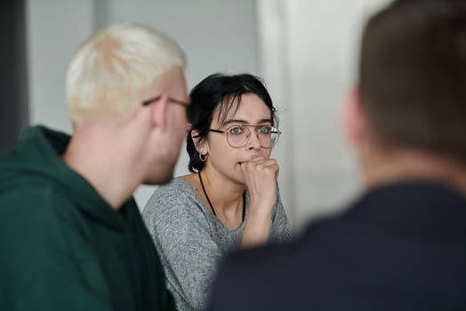 A diverse multiethnic business team engages in a collaborative meeting, discussing strategies and solutions in a modern office setting photo