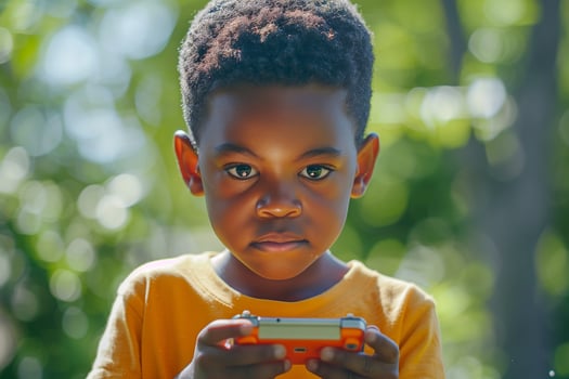 A young boy is holding a cell phone photo