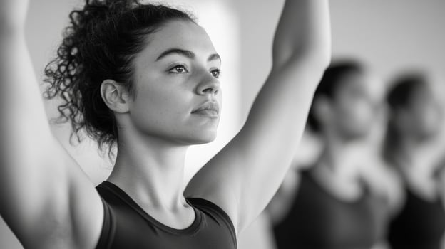 Young woman practicing yoga in a studio during a morning class focusing on mindfulness and concentration photo