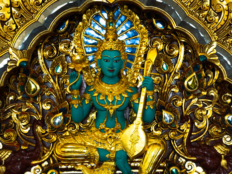 Indra statue Green giant, statues in Thai temples. Thai art in the temple. Calm and believe. photo