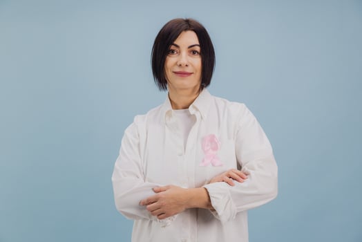 Woman Patient wearing pink ribbon supporting breast cancer awareness and research photo