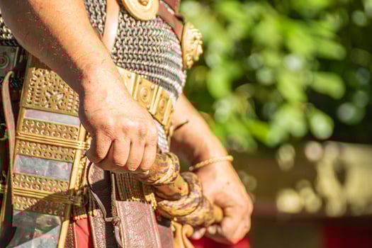 detail of the hands of a centurion of the roman legion with the baton of command in a party of historical recollection. photo