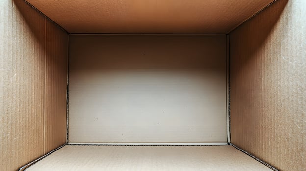 Empty Cardboard Box Interior View Showing Light Beige Walls photo