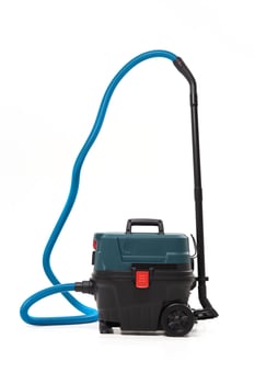 Portable vacuum cleaner with a blue hose for professional cleaning and industrial use isolated on white background photo