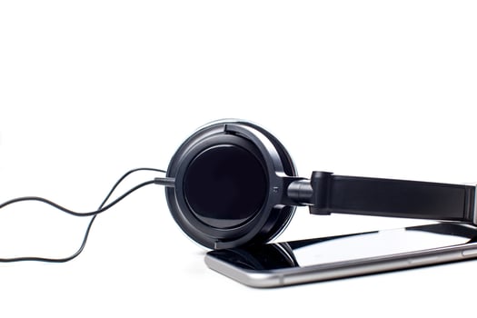 audio player with headphones isolated on white background photo
