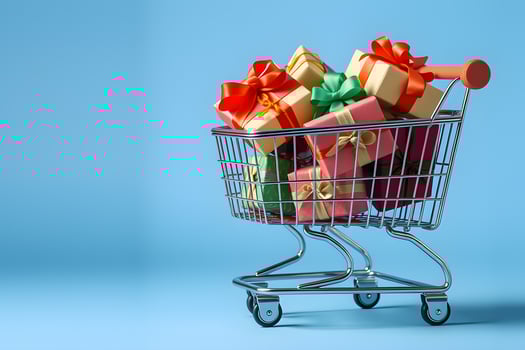 A shopping cart filled with gifts on a blue background photo