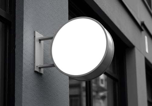 Blank Round Business Sign Mockup on Gray Building photo