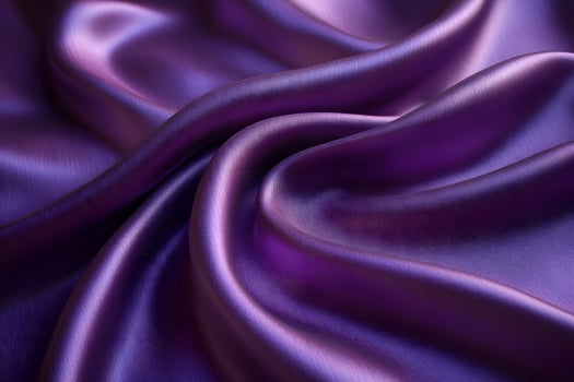 Luxurious Purple Silk Fabric with Soft Folds and Shimmering Surface for Fashion Design and Textures photo