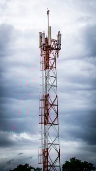Signaling tower in cloudy sky photo