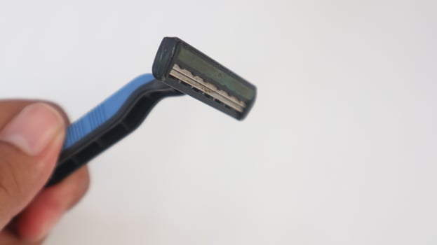 a photo of a mustache trimmer being held