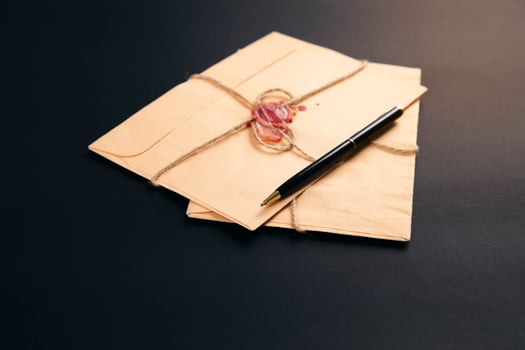 vintage letters and pen on table photo