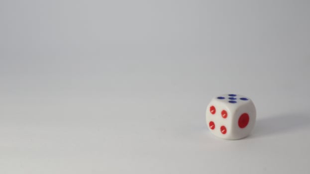 a photo of a dice with the numbers 4, 5, and one visible in the photo and can be used as a background