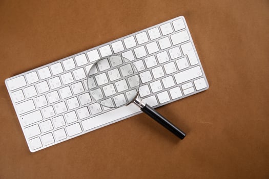 magnifier on the computer keyboard. photo