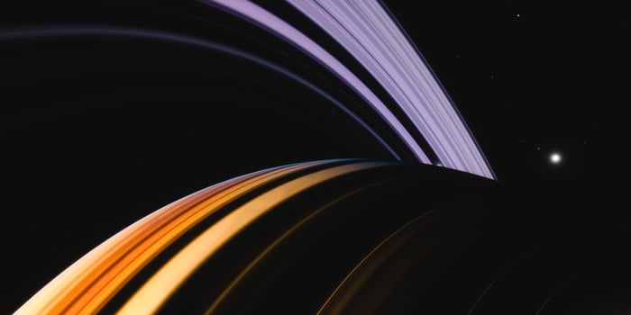 Vibrant planetary rings in cosmic darkness with starry background photo