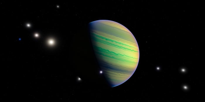 Colorful gas giant planet in deep space with bright stars and dark background photo
