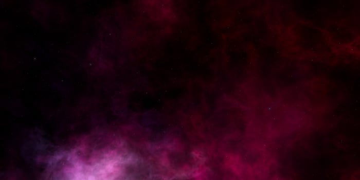 Mystical cosmic nebula with deep purple and red hues in space photo