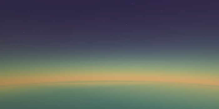 Abstract earth horizon gradient at twilight with deep blue and golden hues photo