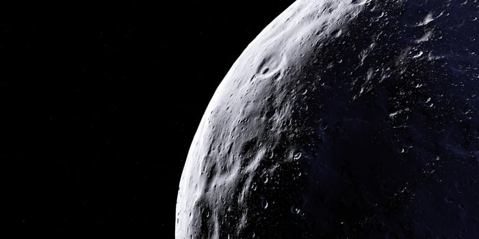 Lunar surface with sunlight and craters against space backdrop photo
