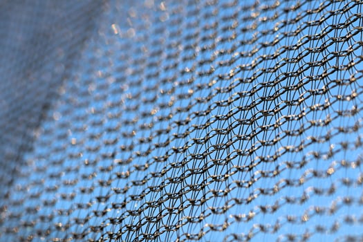 Protective mesh of the walls from a children's trampoline made of fabric durable synthetic mesh photo