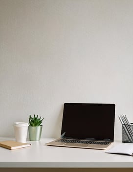 Sleek Home Office Workspace Featuring Laptop and Coffee Cup photo
