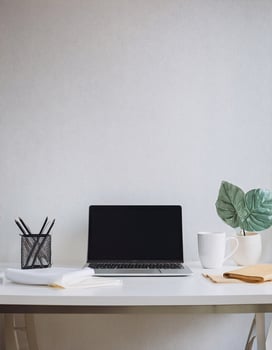 Efficient Home Office Desk with Laptop, Coffee, and Paperwork photo