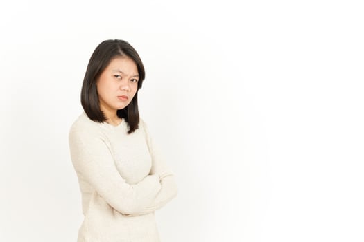 A woman in a sweater standing with her arms crossed photo