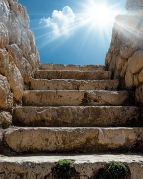 Stone steps leading to bright sunlight photo