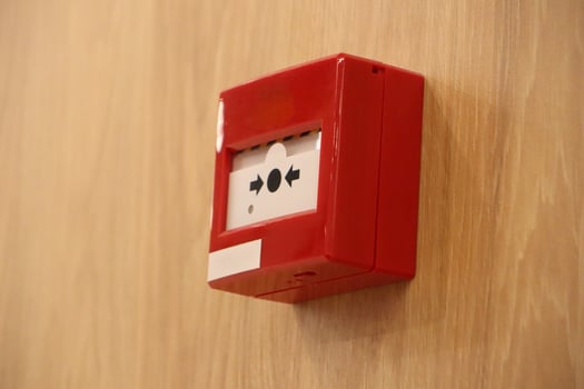 The Fire Alarm Call Point is located prominently on the Wall for immediate use in emergencies photo