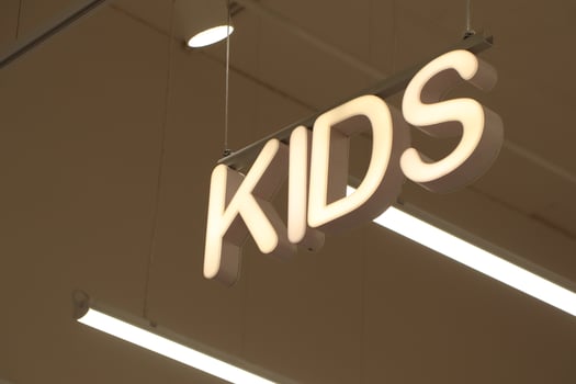 Signage for the Kids Section within a Retail Store to Attract Young Shoppers Effectively photo