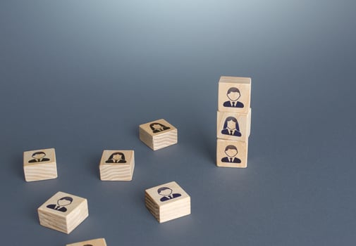 Figurine blocks with employees. Personnel recruitment concept. Team building. Company organization. Hiring, recruiting. Feminization of workforce. Reorganization. Leadership in management. photo