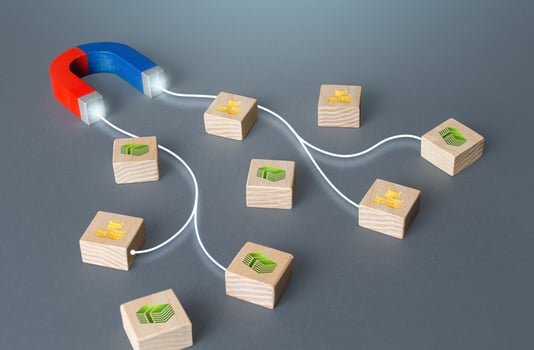 Magnet with lines attracts blocks with money. Profit raising, tax collection. Borrowing loans, attracting investments. Accumulation of funds. Making money, getting rich. Achieving financial success. photo