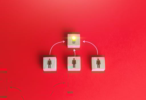 People join forces to develop a new idea. photo
