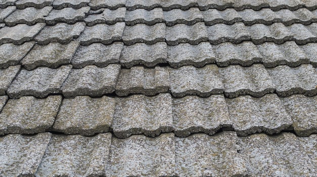 Old stone roof tiles texture. Obsolete roof covering. photo