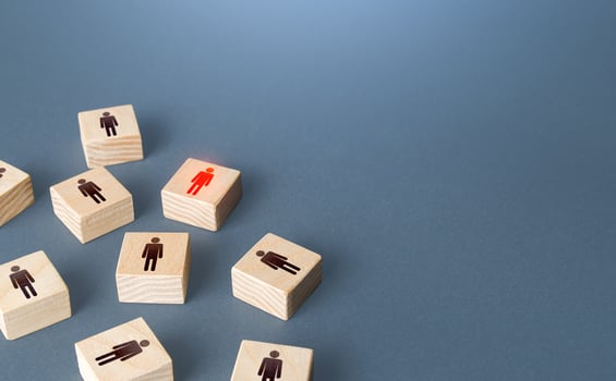 Red highlighted man among randomly people blocks. Recruiting, staffing. Human resources. Employment agency. Finding infected people. Hiring talented professional candidate for a vacant job position. photo